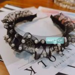 Pinza con forma de mariposa con perlas